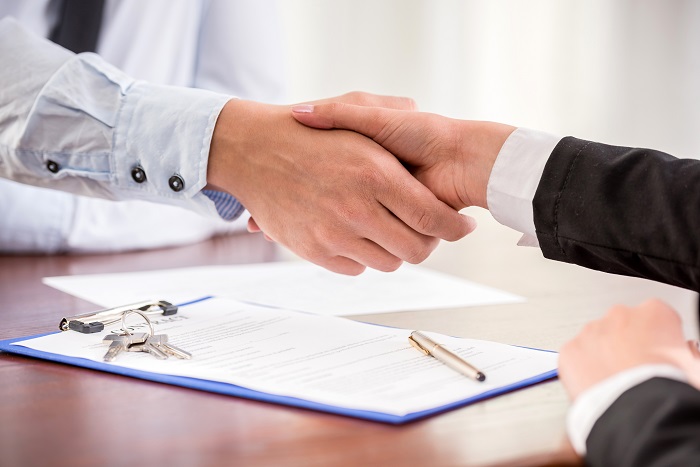 Shaking hands over sales of business contract